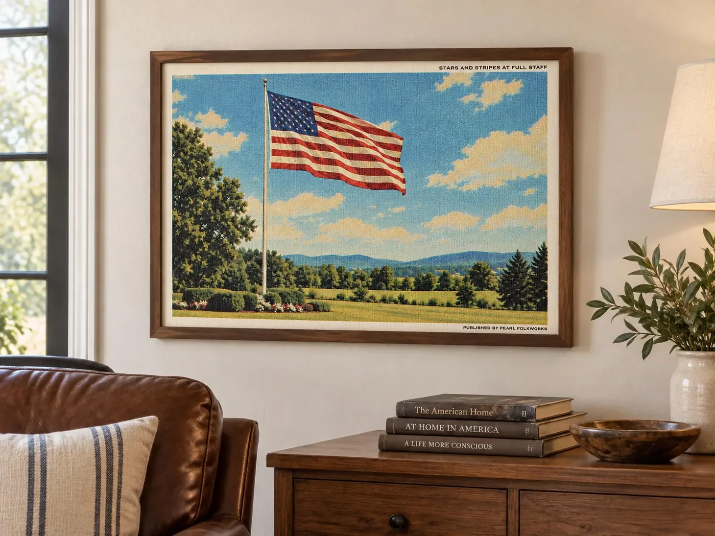 Framed vintage-style American flag wall art with a flag flying against blue skies over green countryside.