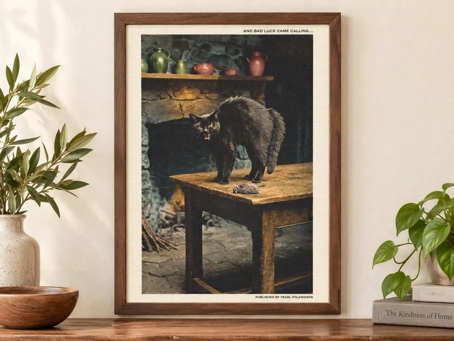Vintage-inspired framed Halloween print of an arched black cat hissing on a wooden table.